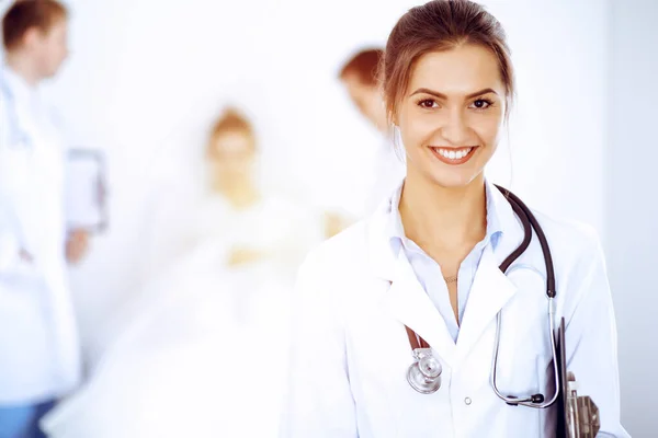 depositphotos_405715298-stock-photo-female-doctor-smiling-on-the